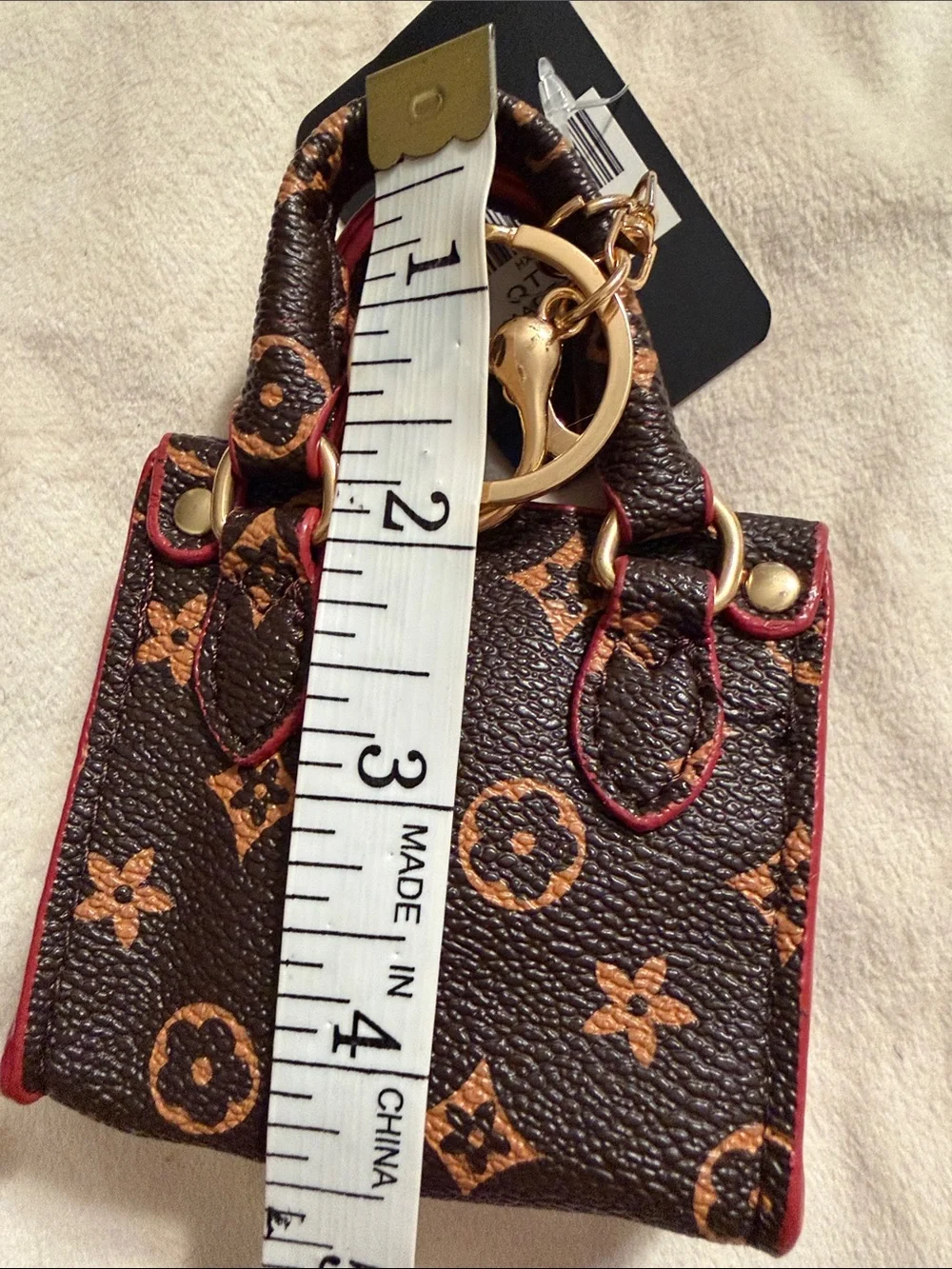 Mini Brown Monogram Keychain Bag with Pink Trim. (85)